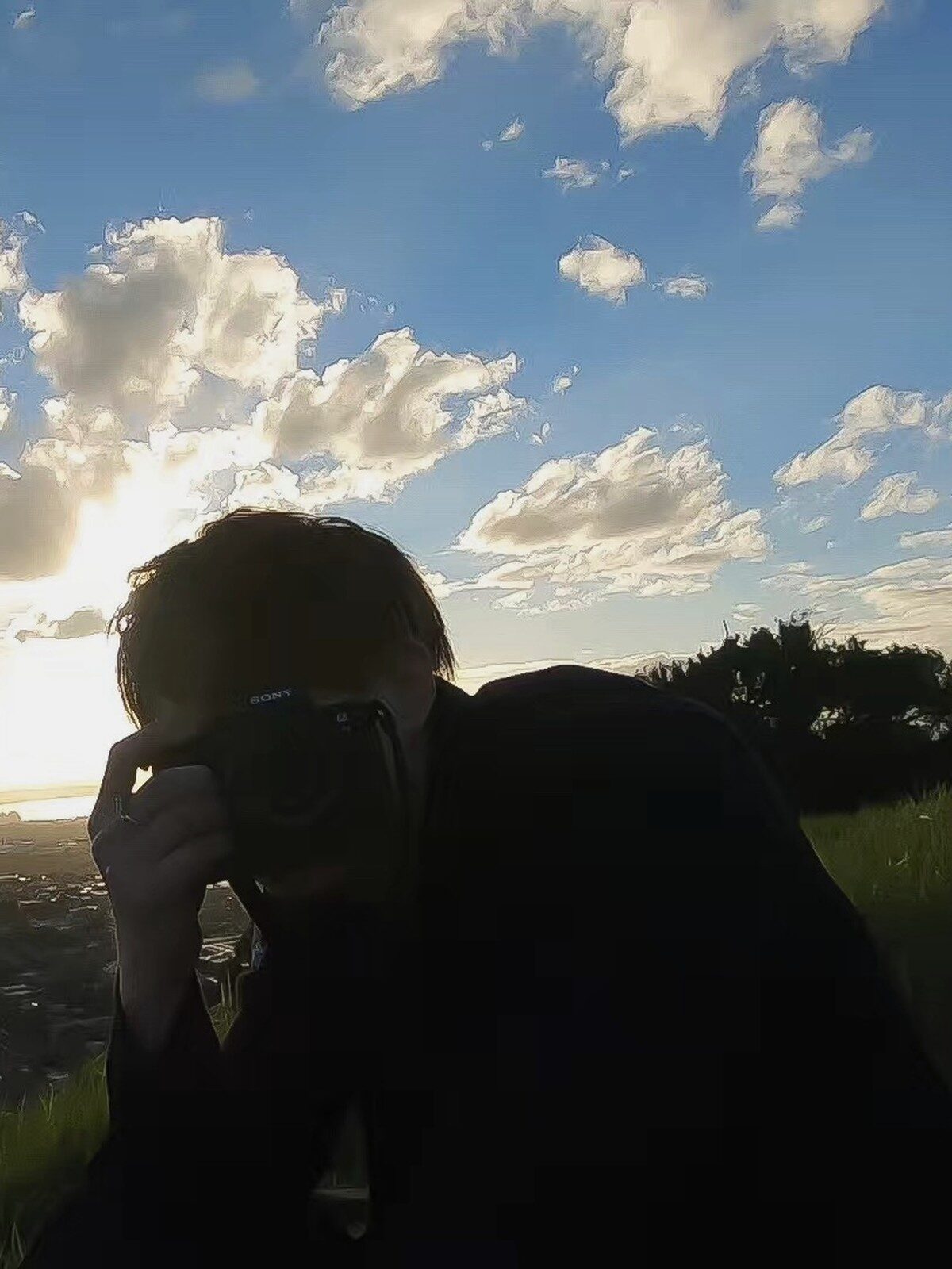 Ian Hu photographing at sunset